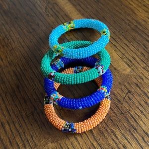 Set of 4 seed bead bracelets handmade from Kenya. 7” flexible. NOT stretch.